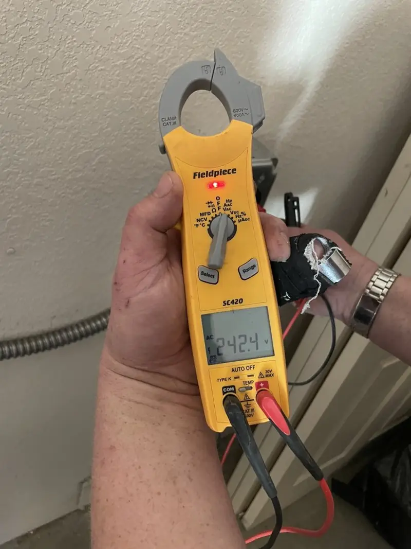Voltage testing with clamp meter during Ceiling Fan Installation in Fort Smith